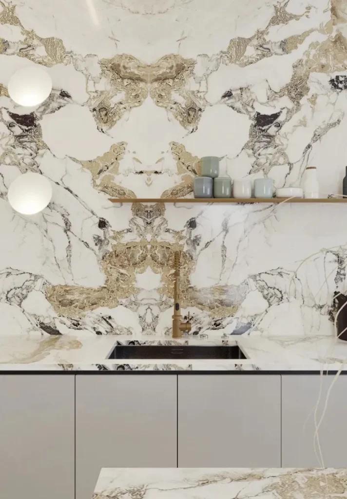 Modern kitchen with white and gold marble backsplash and countertop